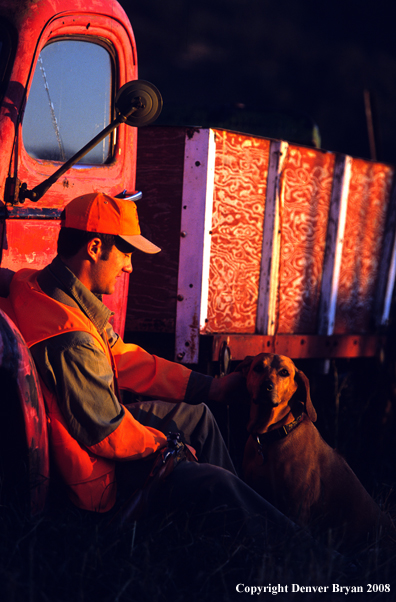 Upland game bird hunter with dog