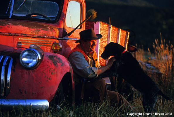 Upland game bird hunter with dog