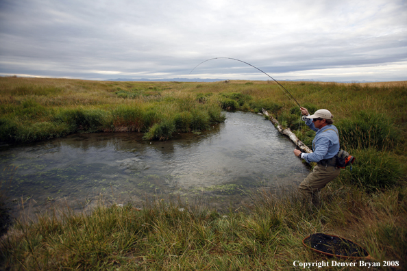 Flyfisherman with fish on