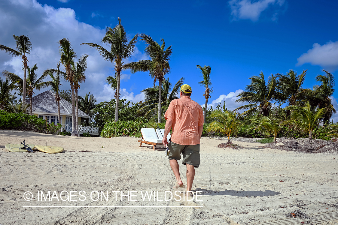 Flyfishermen on beach.