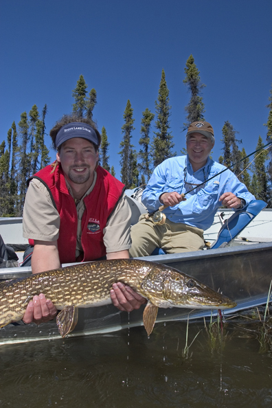 Flyfisherman and guide with northern pike (MR)