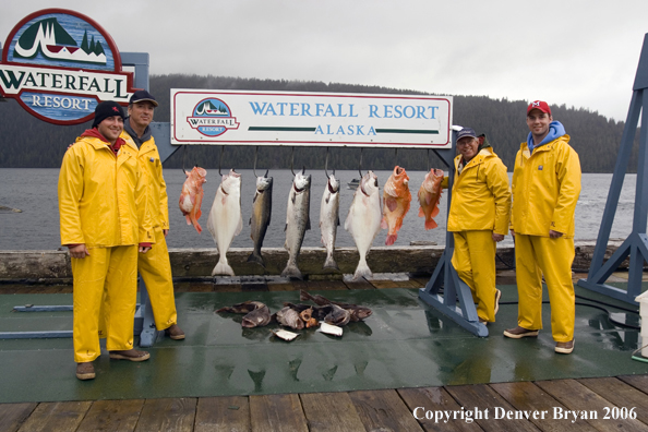 Fishermen with halibut and salmon catch.  (Alaska/Canada)