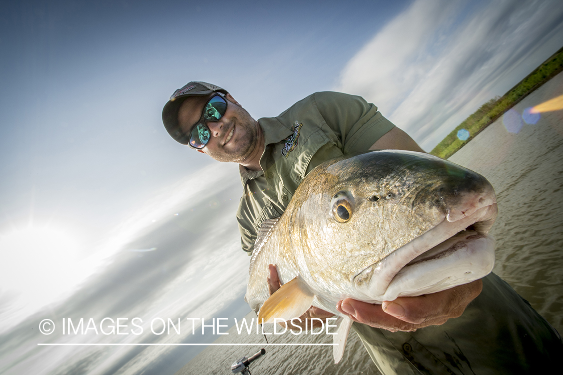 Fisherman with redfish.