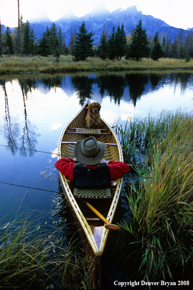 Flyfisherman and Dog in canoe