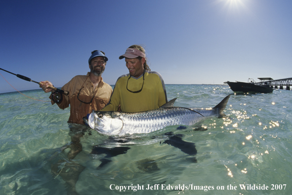 Guide and angler with tarpon