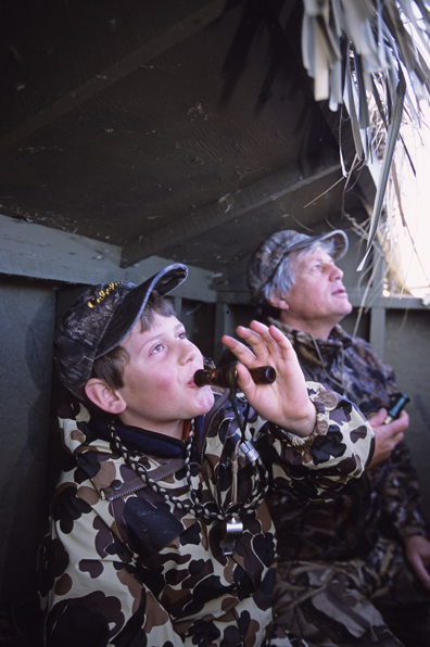 Waterfowl hunters calling for birds.