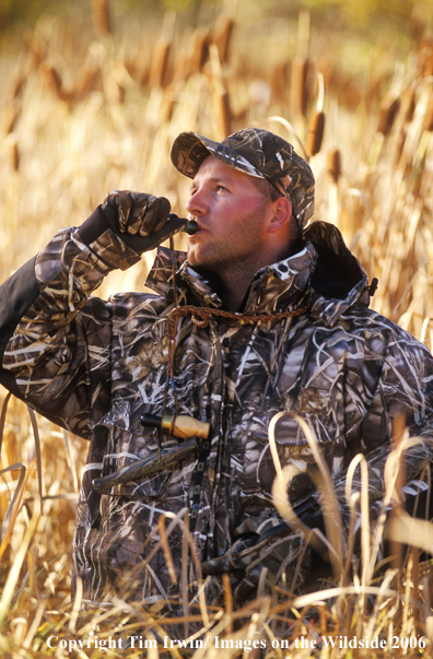 Waterfowl hunter calling.