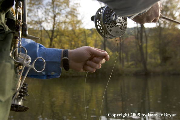 Close-up of flyfisherman's rod and reel on Pennsylvania spring creek.