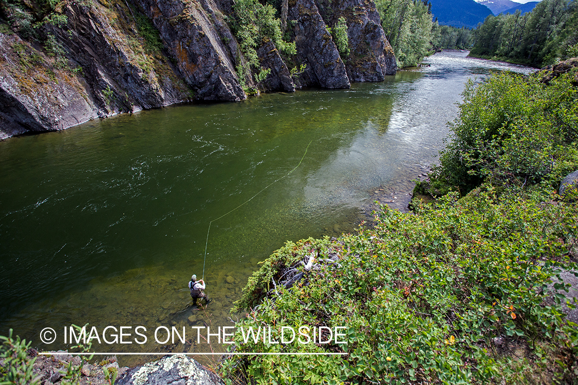 Flyfisherman spey casting on Nakina River, British Columbia.