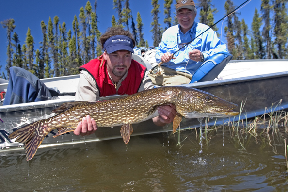 Flyfisherman and guide with northern pike (MR)