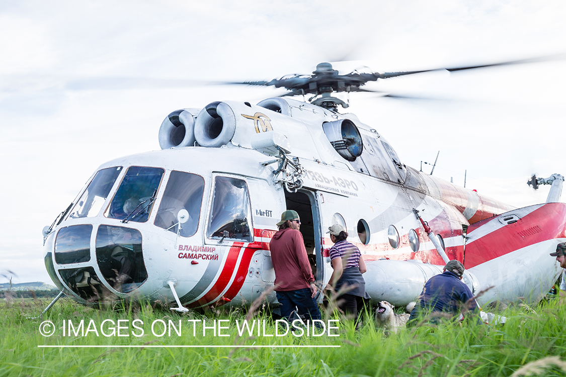 Loading gear into Russian helicopter in Kamchatka Peninsula, Russia. 