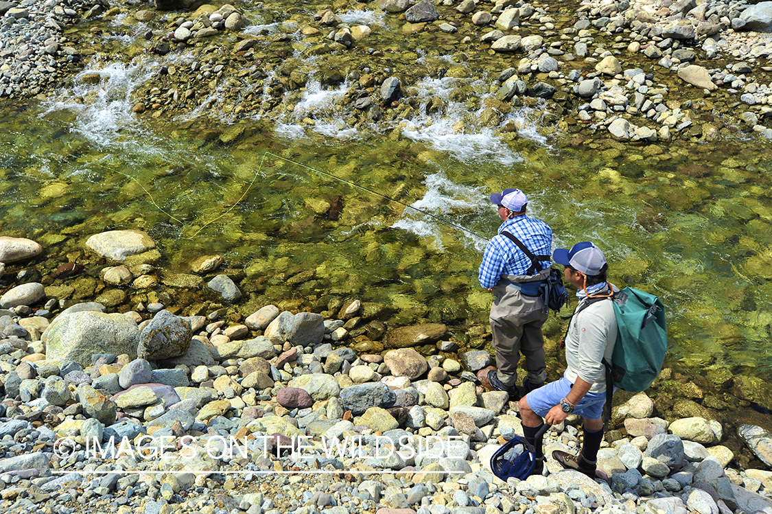 Fishermen on river.