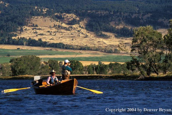 Flyfishermen fishing from driftboat.