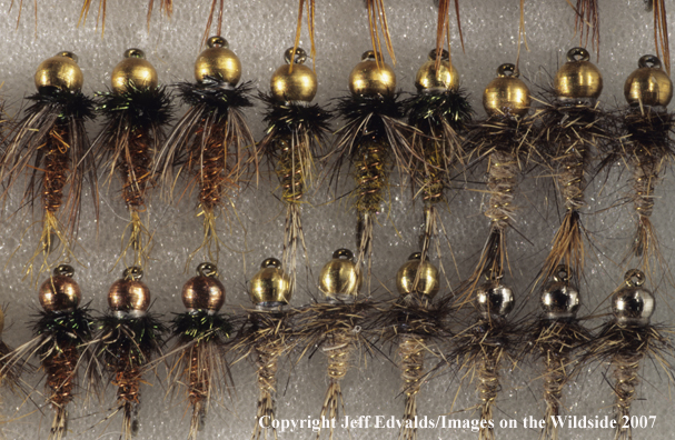 Close-up of beadhead flies in a box