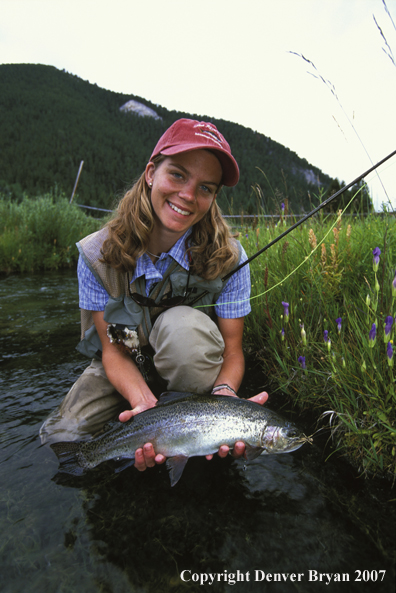 Flyfisher with rainbow trout.