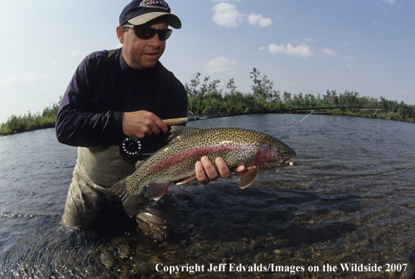 Flyfisherman with a nice Rainbow Trout