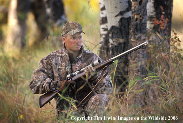 Muzzleloader hunter in field.