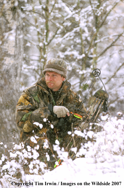 Whitetail bowhunter in the snow.