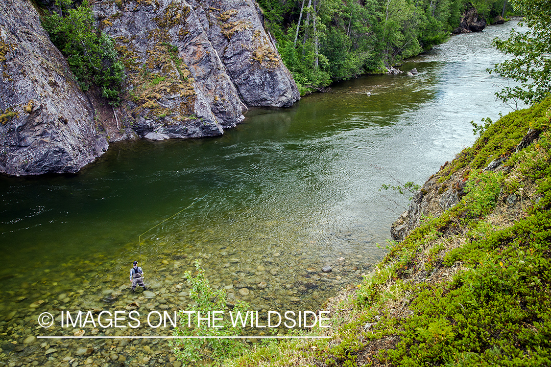 Flyfisherman spey casting on Nakina River, British Columbia.