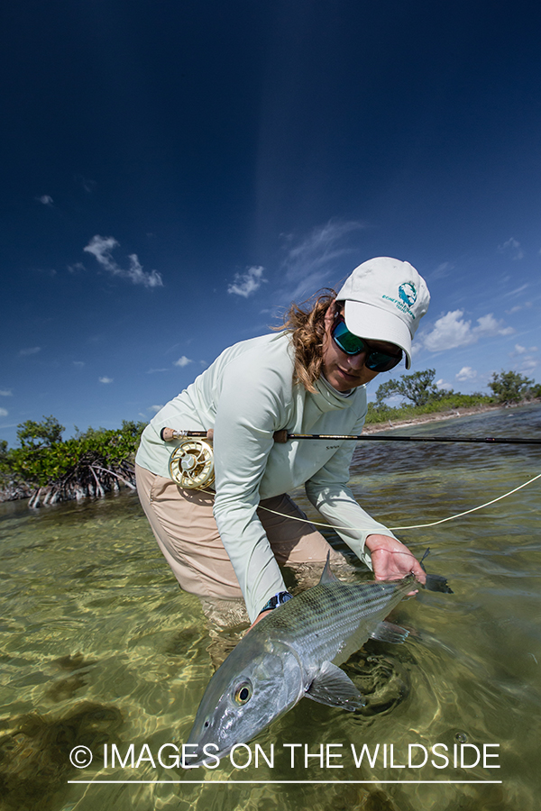 Flyfishing woman with bonefish.