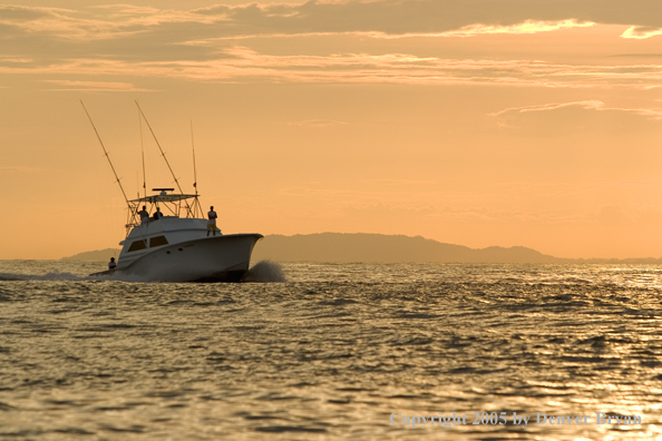 Deep sea fishing charter boat on ocean.