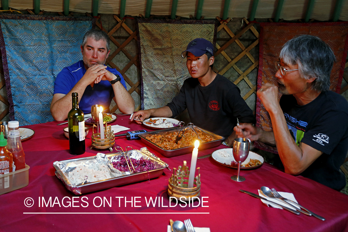 Three fishing guides in ger camp, Mongolia.