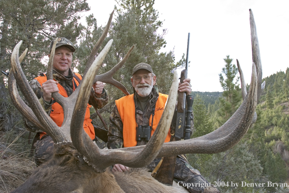 Big game hunters with bagged elk.