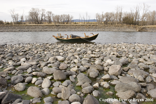 Drift boat on river.