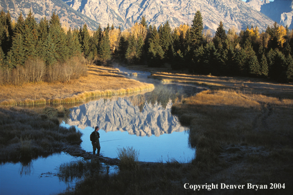 Flyfisherman crossing river.