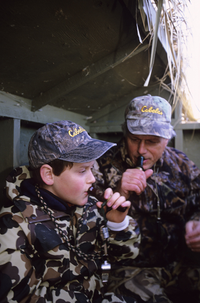 Waterfowl hunters calling for birds.