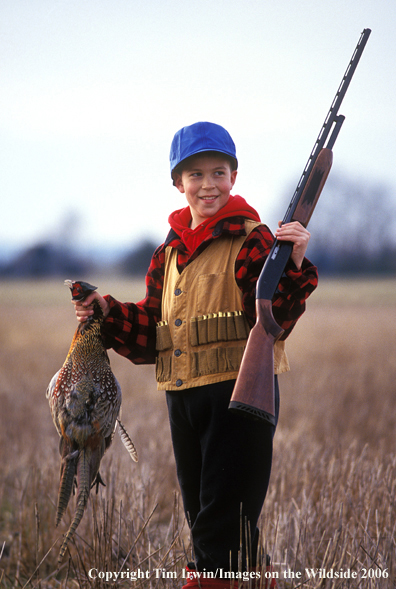 Young hunter bags his first pheasant.