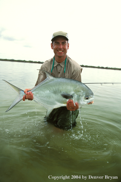 Saltwater flyfisherman holding permit.