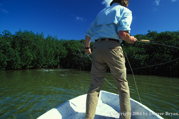 Saltwater flyfisherman fighting tarpon.