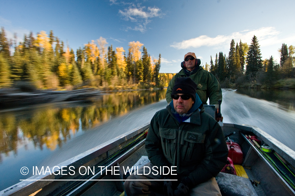 Flyfishermen on boat. 