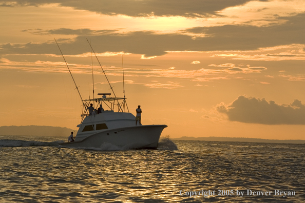 Deep sea fishing charter boat on ocean.