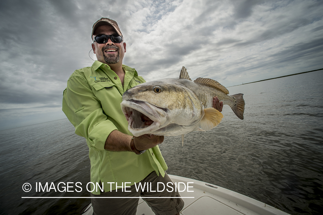 Fisherman with redfish.