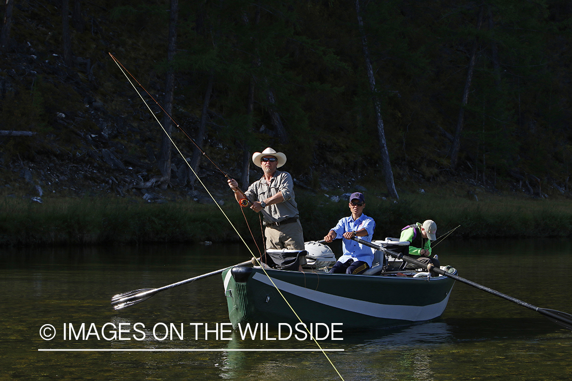 Flyfisherman casting spey/switch rod on Delger River, Mongolia.