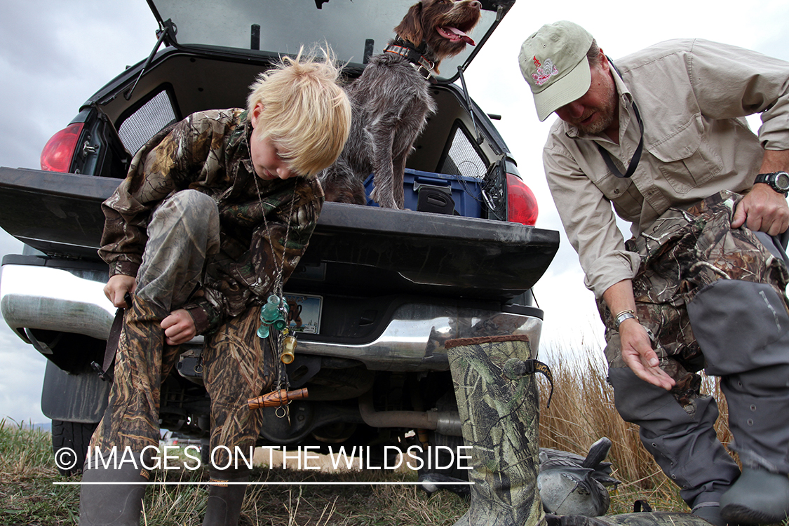 Father and son waterfowl hunters getting ready.