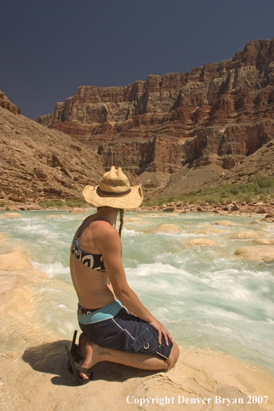 Woman sitting along side the Little Colorado River.  Grand Canyon.