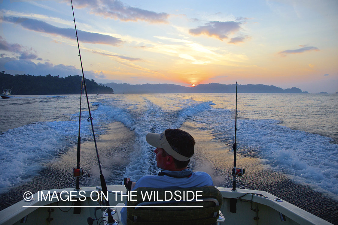 Fisherman on deep sea fishing boat.