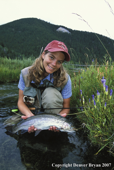 Flyfisher with rainbow trout.