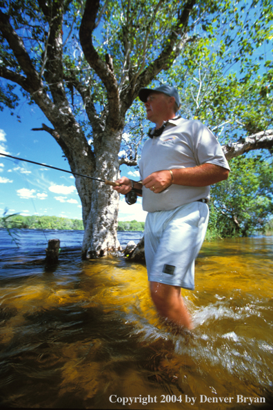 Flyfisherman fishing for tiger fish.