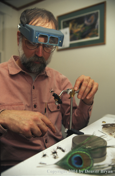 Flyfisherman tying flies.