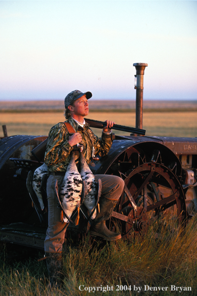 Waterfowl hunter with bagged White-fronted geese.