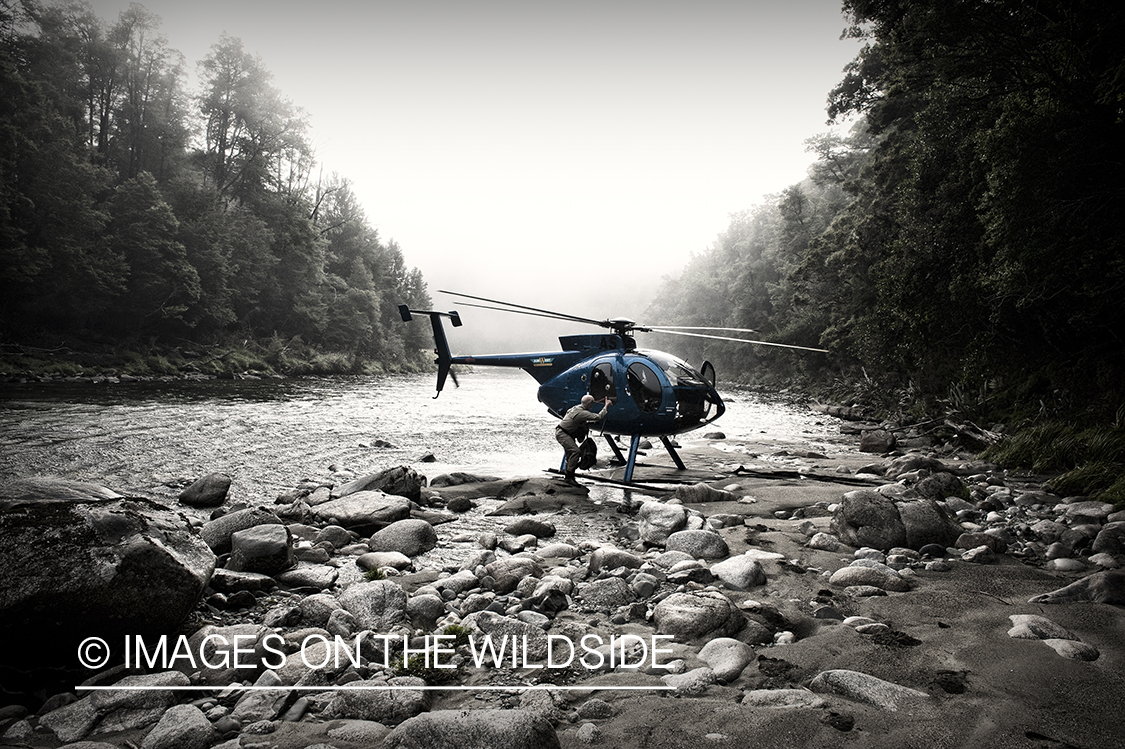 Flyfisherman loading into helicopter.