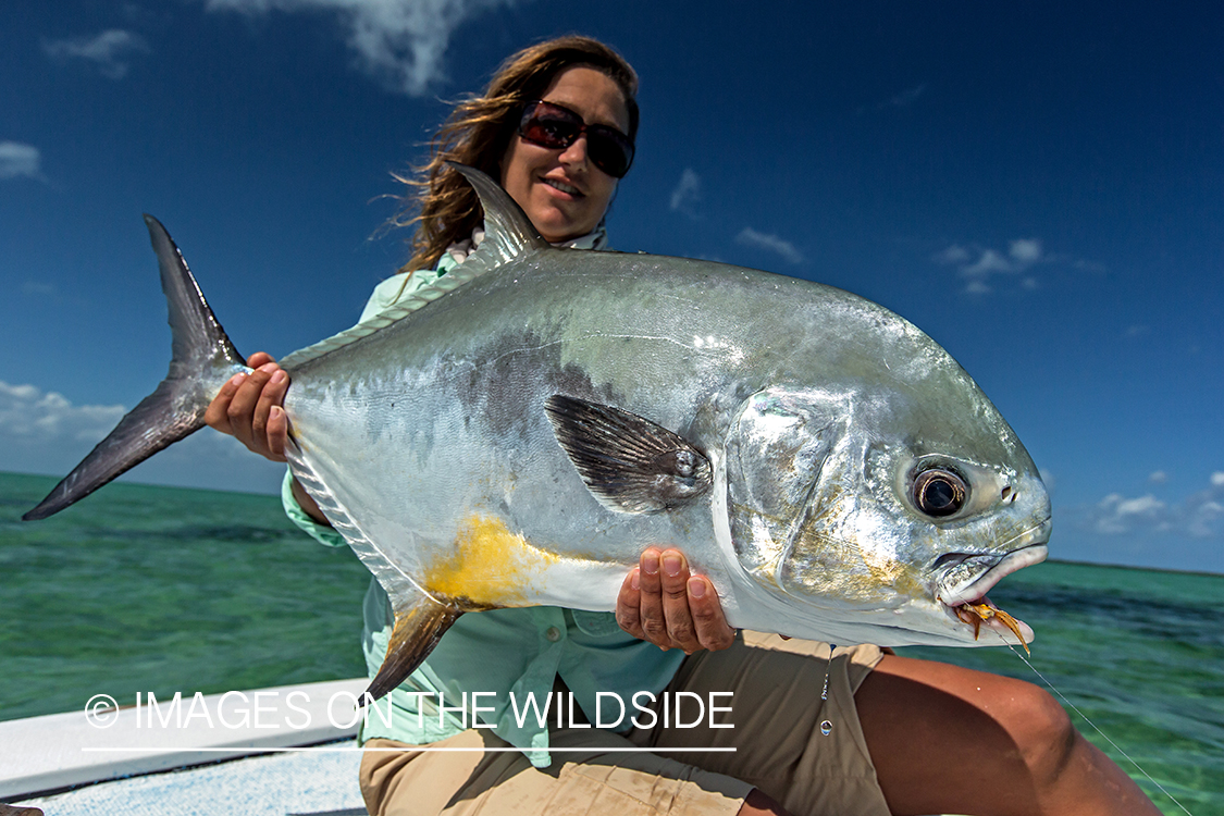 Woman flyfisherman with permit.