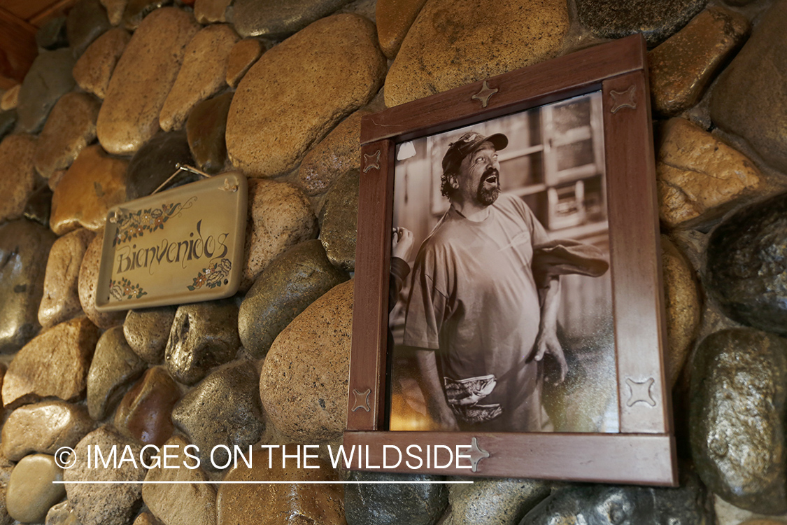 Picture next to welcome sign in lodge.