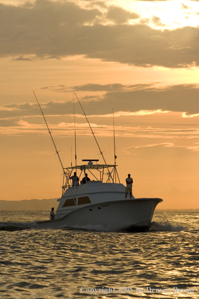 Deep sea fishing charter boat on ocean.