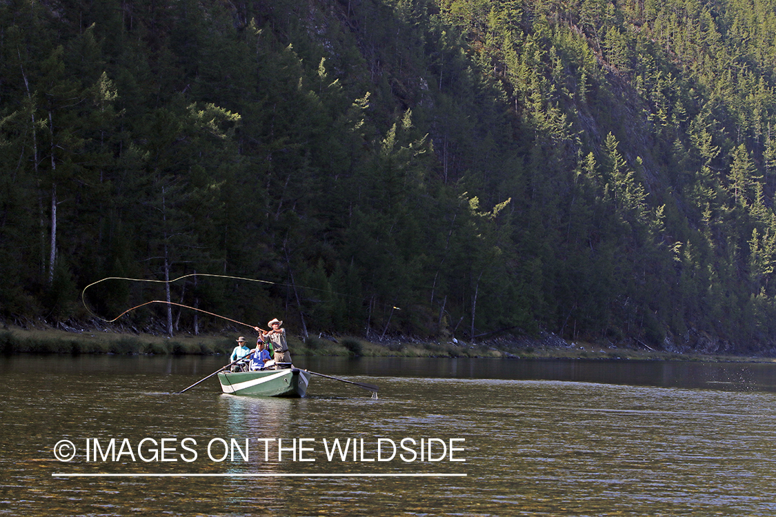 Flyfisherman casting spey/switch rod on Delger River, Mongolia.