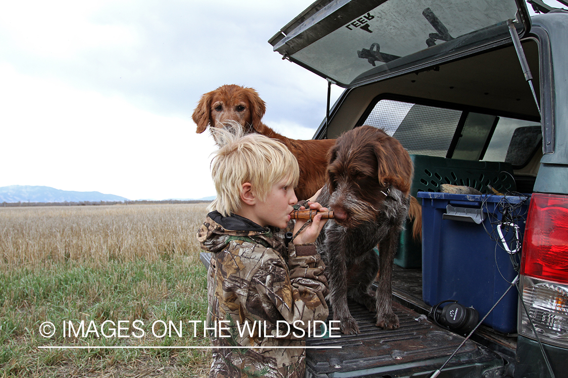 Father and son waterfowl hunters getting ready.